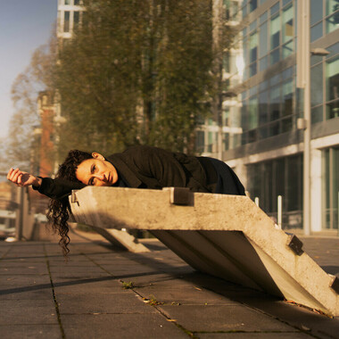 Raquel Meseguer lies on a concrete construction in the city.